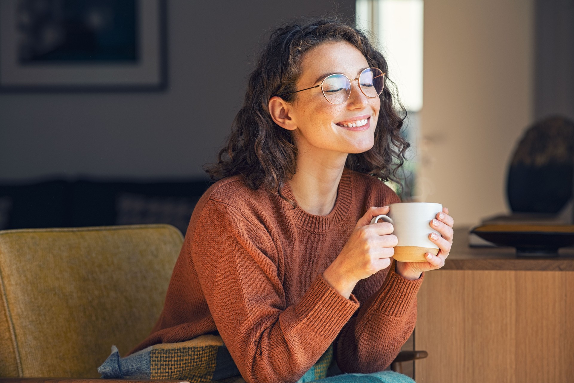 woman relaxing and drinking after hypnotherapy 